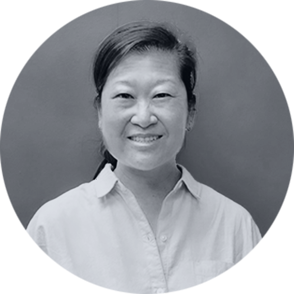 Smiling Asian Woman Professional Portrait Smiling Asian woman with dark hair pulled back, wearing a light collared shirt, in a black and white circular portrait.